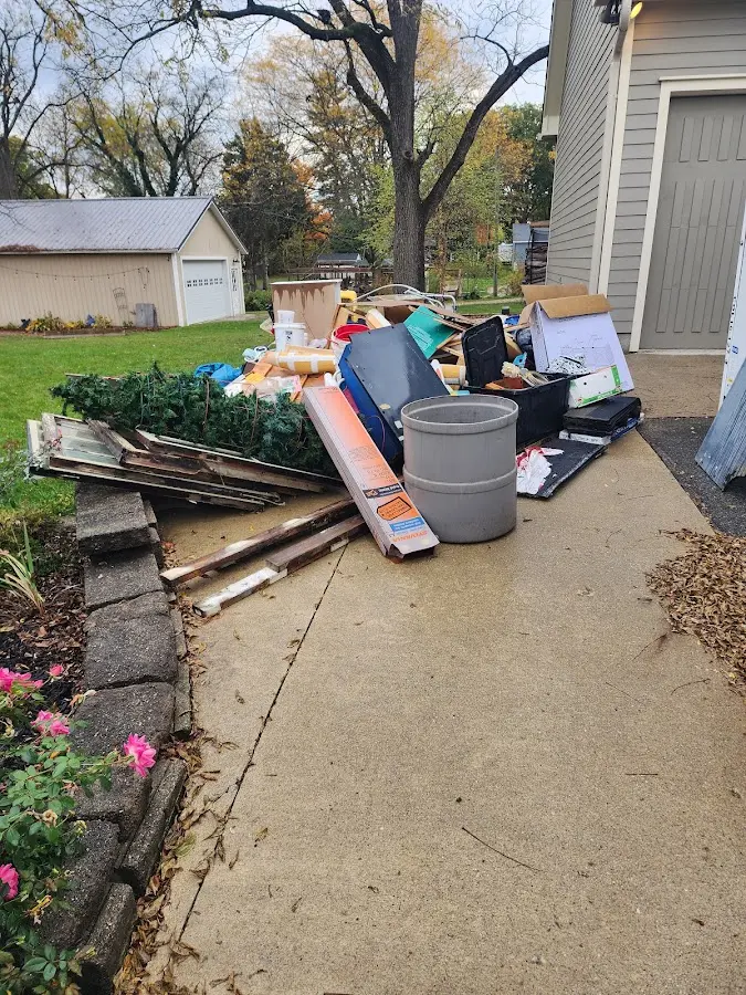 Dumpster being loaded with debris for 30 Yard Dumpster Rental in Stanhope